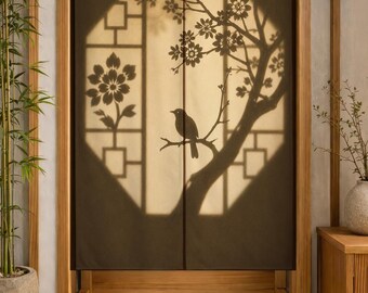 May include: A dark brown fabric door curtain featuring a central light-colored octagonal cutout design. The design displays a silhouette of a bird perched on a flowering branch, a large flower, and geometric lattice patterns within the light area.