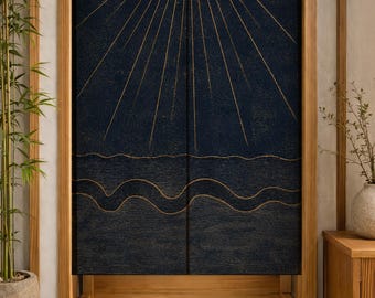May include: A dark navy blue fabric door curtain featuring a gold-colored line art design of a sunburst radiating from the top center above stylized wavy lines representing water, split vertically into two panels hanging within a wooden frame.