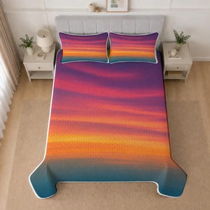May include: A bedspread and two matching pillow shams featuring a vibrant gradient print that transitions from deep purple at the top to bright orange and yellow in the center, fading into a dark teal blue at the bottom edge of the bed.