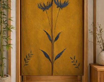 May include: A mustard yellow fabric door curtain featuring a dark blue botanical print of two tall flowers centered on the panels, with smaller leaf sprigs positioned in the four corners of the rectangular textile hanging.