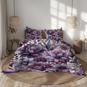 May include: Purple floral duvet cover with a white background. The duvet cover features large purple flowers and leaves.