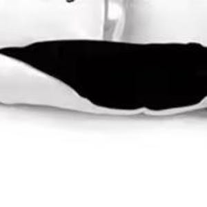 a bed with a black and white comforter and pillows