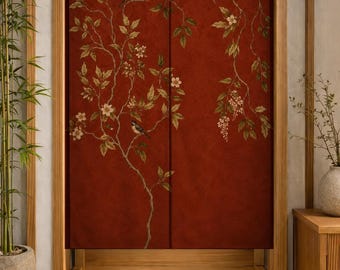 May include: A rectangular fabric door curtain featuring a deep red background with a printed pattern of thin brown branches, green leaves, white blossoms, and two small birds perched on the limbs, split vertically down the center.