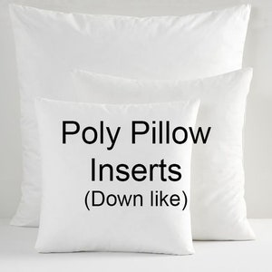 May include: Two white pillow inserts, one on top of the other. The smaller pillow has the text "Poly Pillow Inserts (Down like)" printed on it.
