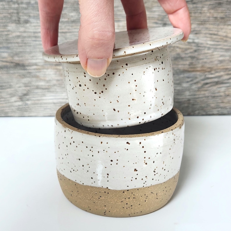 Insert the butter bell portion into the base.  Together the portions keep butter fresh and spreadable at room temperature.