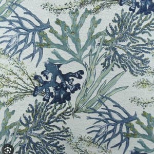 May include: A repeating pattern of stylized aquatic plants in shades of blue and green on a cream background. The design features various forms of seaweed and coral, creating a marine-themed textile or surface design.