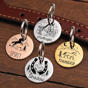 May include: Four round pet tags with horse-themed designs. The tags are in copper, silver, and gold tones, each with a different horse illustration and name: "Spirit," "Midnight," "Thunder," and "Shadow." Each tag has a silver ring for attachment.