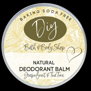 May include: A white round container with a silver lid. The label says "BAKING SODA FREE Diy Bath & Body Shop NATURAL DEODORANT BALM Grapefruit & Tea Tree".