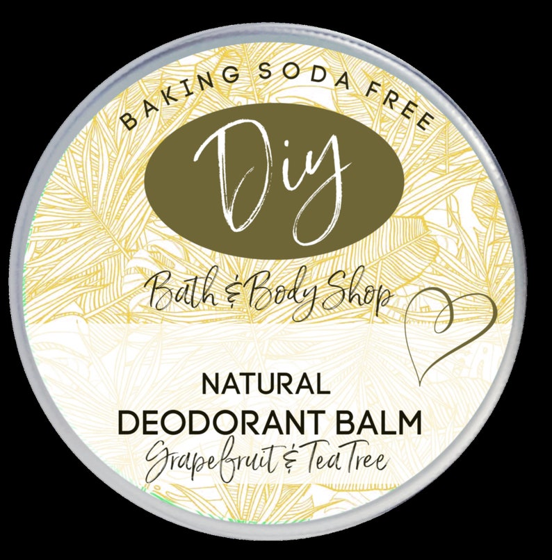 May include: A white round container with a silver lid. The label says "BAKING SODA FREE Diy Bath & Body Shop NATURAL DEODORANT BALM Grapefruit & Tea Tree".