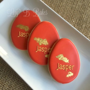 12 Red Egg Baby Cookies with Gold detail!