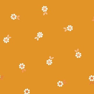 May include: A seamless pattern featuring small white daisies with orange centres and green leaves on a mustard yellow background. The pattern is repeated throughout the fabric.