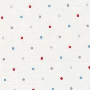 May include: White fabric with a scattered polka dot pattern in red, blue, and grey. The fabric is marked with a ruler in inches and the text "moda" appears twice.