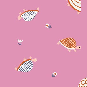 May include: Pink fabric with a repeating pattern of turtles and flowers. The turtles are in various colours and patterns, including blue, white, orange, and brown. The flowers are white with yellow centres.