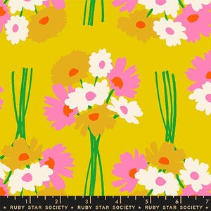 May include: A mustard yellow fabric featuring a repeating pattern of flower bouquets with white, pink, and golden-brown petals and green stems. A black measuring tape at the bottom shows 18 cm, with the text Ruby Star Society printed repeatedly.