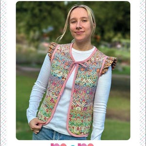 May include: A reversible patchwork vest with a floral design, pink trim, and frilled sleeves. The vest is tied with a pink ribbon. The image includes the text "HARMONY VEST" and "LADIES REVERSIBLE PATCHWORK VEST".
