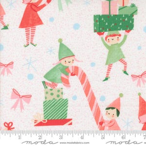 May include: White fabric featuring a repeating pattern of Christmas elves, gifts, candy canes, snowflakes, and bows. The elves wear red and green outfits, and the gifts are wrapped in green and pink paper. The bows are pink.