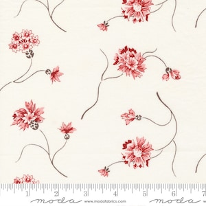 May include: A white fabric with a repeating pattern of small pink flowers with brown stems. The fabric has a ruler with inches marked on it and the word "moda" printed on it.