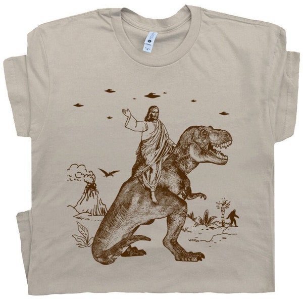 Jésus chevauchant un dinosaure T-shirt OVNI T-shirts drôles T-shirt offensif T-shirts graphiques cool Chemises folles pour hommes, femmes, gars