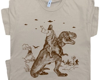Jesus Riding Dinosaur T Shirt Funny T Shirts for Men Women UFO T Shirt Offensive Shirt Cool Graphic T Shirts Crazy Shirts T Rex Novelty Tee