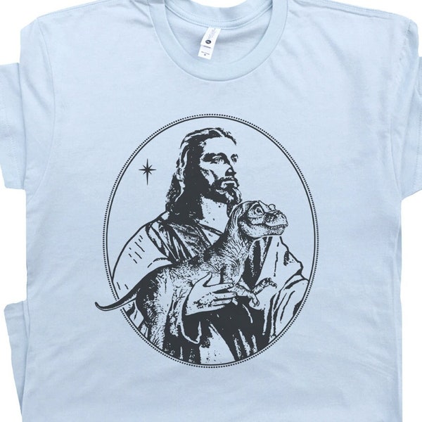 Jesus Holding Dinosaur T Shirt Funny Shirts for Men Women Offensive T Shirts Weird Unusual Raptor Cool Christian Shirts Graphic Tee T-Rex