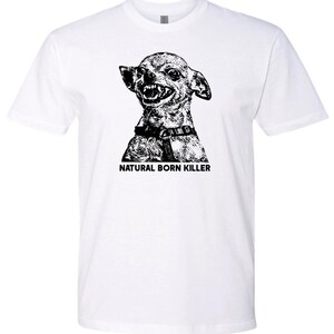 May include: White t-shirt with a black and white illustration of a chihuahua with the text "Natural Born Killer" printed on the front.