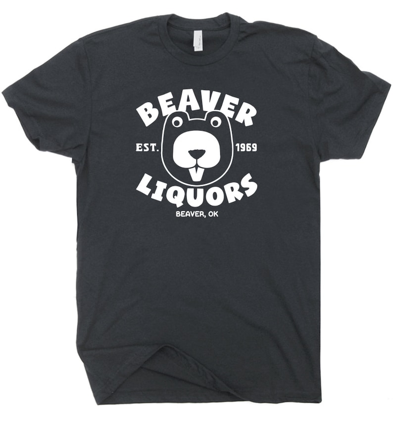 May include: A black t-shirt with a white graphic of a beaver with the text "Beaver Liquors" in a circle around it. The text "Est. 1969" is above the beaver and the text "Beaver, OK" is below the beaver.