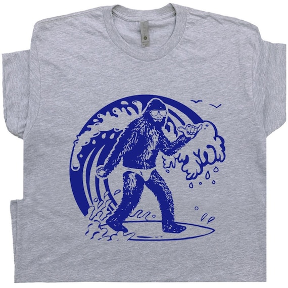 Bigfoot Surfing T Shirt Cool Surf Shirts Retro Vintage Surfing Tee Surfer Graphic Cryptid Surfboard For Men Women Kids 70s Ocean Wave Tshirt