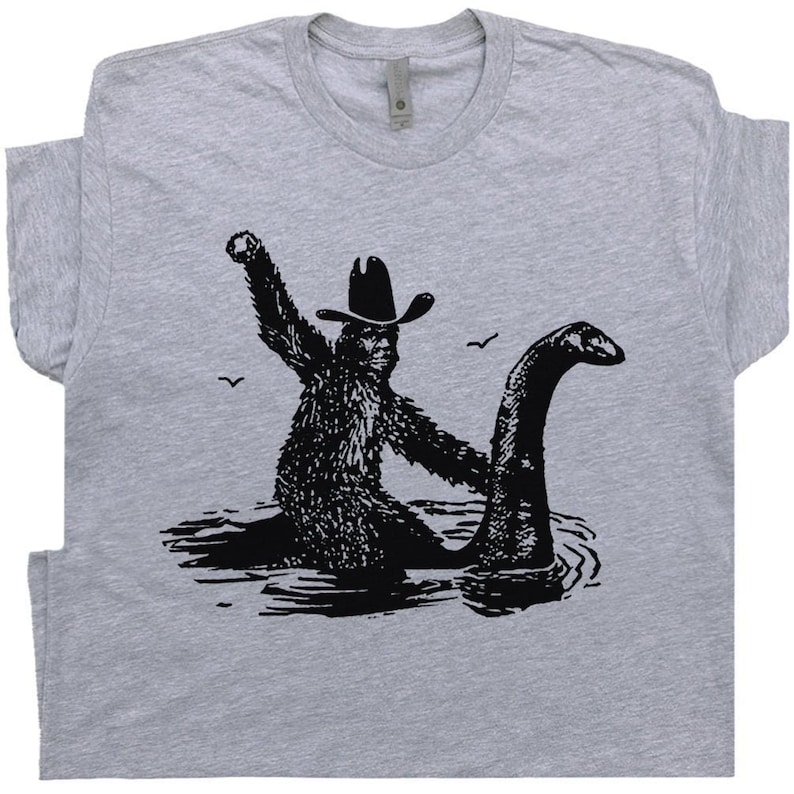 bigfoot riding loch ness monster shirt funny t shirts for men women