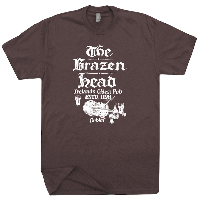 May include: A brown t-shirt with a white graphic of The Brazen Head, Ireland's Oldest Pub, established in 1198, in Dublin.