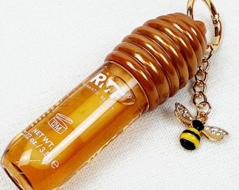 Brillo labial de miel con llavero de abeja
