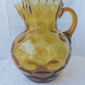 Vintage Hand-blown Amber Glass Pitcher WIth Ruffled Top And Dot Pattern