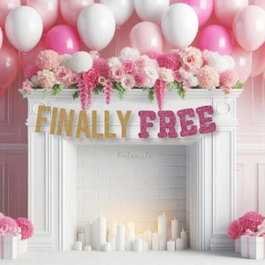 May include: A party scene featuring pink and white balloons, floral arrangements, and a white fireplace. A banner reading "FINALLY FREE" in gold and pink glitter hangs above the fireplace. The decor is for a special event.