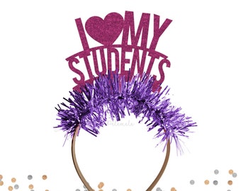 May include: Purple and pink headband with a glitter cutout that says "I love my students".