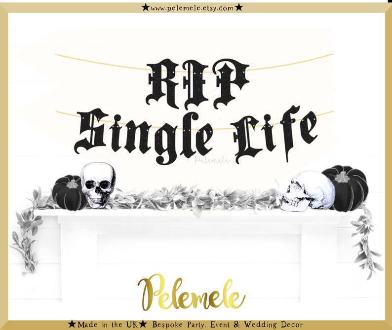 May include: Black and white banner with the text "RIP Single Life" in a gothic font. The banner is strung with a gold string and is decorated with small white dots. The banner is displayed on a white mantel with black pumpkins and skulls.