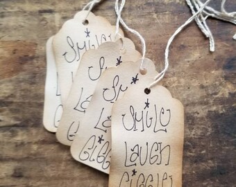 Rustic Hang tags Smile Laugh Giggle set of 25 Gift Tags pre strung Craft Supply