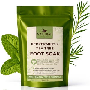 May include: A green pouch of peppermint and tea tree foot soak. The label reads "Natural Escapes Body" and lists ingredients like Epsom salt and essential oils. The product is designed for healthy feet and toenails, with a net weight of 16 oz / 1 lb.