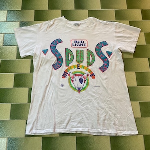 May include: White t-shirt with a colorful graphic design. The design includes the text "BUD LIGHT SPUDS ECKER" with a bull terrier dog illustration. The shirt has a crew neck and short sleeves.