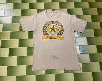 Vintage 90-tals Banana Republic Sliten Trashed T-shirt Storlek Stor Propagandaminister