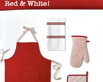 May include: A red apron, white kitchen towel with red stripes, a pink oven mitt, and a matching pot holder. The text at the top reads "Craft, Teach or Celebrate in Red & White!" These kitchen accessories are perfect for cooking and baking.