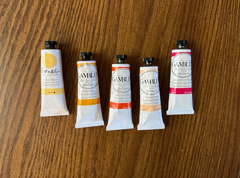 5 tubes of Gamblin Artist Oil Colors. The colors are Naples Yellow, India Yellow, Cadmium Orange, Naples Orange, and Quinacridone Magenta edusite https://edusite.etsy.com