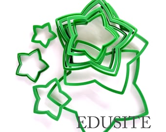 May include: A collection of bright green star-shaped cookie cutters in various sizes, nested and arranged in a cluster. The set includes several individual star outlines of differing dimensions, with the text EDUSITE printed in black at the bottom.