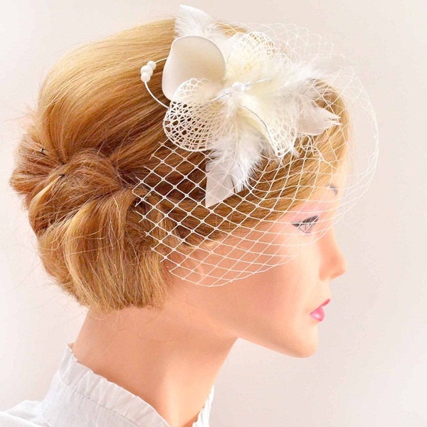White feather fascinator with a mini birdcage veil, Wedding hair accessory, Bridal veil clip