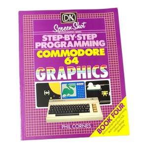 May include: A retro book on Commodore 64 graphics programming. The cover is purple with the title "STEP-BY-STEP PROGRAMMING COMMODORE 64 GRAPHICS" and author Phil Cornes. The book includes illustrations of a Commodore 64 computer and is part of the DK Screen Shot series.