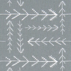 May include: A grey fabric with a white repeating pattern of stylised pine trees and arrows.