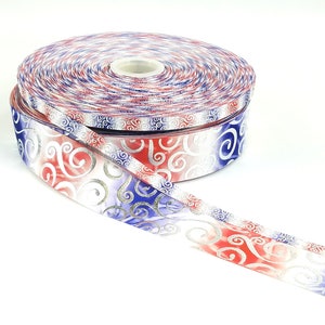 May include: A roll of red, white, and blue ribbon with a silver swirl pattern. The ribbon is rolled up and the end is unfurled.