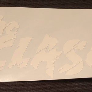 May include: White vinyl decal with the words "The Clash" in a distressed font.