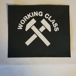 May include: Black fabric patch with white text that reads "WORKING CLASS" in a circle around two crossed white hammers.