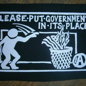 A "Please put government in it's place" back patch punk