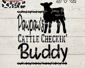 May include: Black and white silhouette of a calf with the text "Pawpaw's Cattle Checkin' Buddy" in a black, handwritten font. The background is a light wood grain.