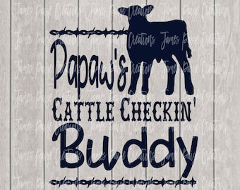 May include: Black and white silhouette of a calf with barbed wire and the text "Papaw's Cattle Checkin' Buddy" on a woodgrain background.